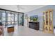 The living room has tile floors, lots of natural light, and access to the lanai at 14130 Rosemary Ln # 3203, Largo, FL 33774