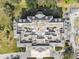 Rooftop view of condo complex revealing rooftop features, meticulous landscaping and parking areas at 14820 Rue De Bayonne # 205, Clearwater, FL 33762