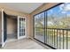 Bright balcony with sliding glass doors and outdoor views at 14820 Rue De Bayonne # 205, Clearwater, FL 33762