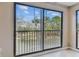 Balcony featuring an outdoor view and sliding glass doors at 14820 Rue De Bayonne # 205, Clearwater, FL 33762