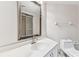 Bathroom featuring a large mirror, modern vanity, and updated toilet at 14820 Rue De Bayonne # 205, Clearwater, FL 33762