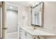Bright bathroom with updated vanity, mirror, and plenty of space at 14820 Rue De Bayonne # 205, Clearwater, FL 33762