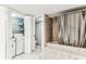 Bathroom view showcasing the tub, shower, toilet, and laundry area at 14820 Rue De Bayonne # 205, Clearwater, FL 33762