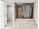 Tiled bathroom features tub and shower combo, with steps, next to a separate toilet room at 14820 Rue De Bayonne # 205, Clearwater, FL 33762
