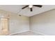 Well-lit room with a large window, ceiling fan, and neutral-colored walls at 14820 Rue De Bayonne # 205, Clearwater, FL 33762