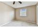 Cozy bedroom featuring neutral walls and a window providing natural light at 14820 Rue De Bayonne # 205, Clearwater, FL 33762