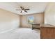 Bright bedroom with a ceiling fan and a window providing views of the yard at 14820 Rue De Bayonne # 205, Clearwater, FL 33762