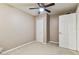 Bedroom featuring a ceiling fan and spacious closet at 14820 Rue De Bayonne # 205, Clearwater, FL 33762