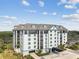 Well-maintained condo building with exterior architecture, lovely landscaping, and convenient covered parking at 14820 Rue De Bayonne # 205, Clearwater, FL 33762
