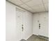 Hallway with 205, 206 doors, door mats, patterned carpet, and neutral-colored walls at 14820 Rue De Bayonne # 205, Clearwater, FL 33762