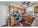 Well-lit kitchen with stainless steel appliances, granite countertops, and wood cabinetry at 1816 Nursery Rd, Clearwater, FL 33764