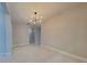 Bright dining room featuring tile floors and a modern light fixture at 20092 Stone Pine Cir, Lutz, FL 33558