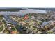 Stunning aerial view of waterfront homes and lush landscaping in desirable community at 2031 Tanglewood Ne Way, St Petersburg, FL 33702