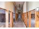 Hallway showing the layout and design, with a tiled floor and an open ceiling at 2031 Tanglewood Ne Way, St Petersburg, FL 33702