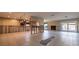 Open-concept layout showing the kitchen, fireplace and back sliding doors ready for remodeling at 2031 Tanglewood Ne Way, St Petersburg, FL 33702