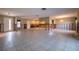 Large living room featuring tile flooring and generous natural light, ready for renovation at 2031 Tanglewood Ne Way, St Petersburg, FL 33702