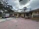 Backyard featuring a brick patio area needing repair at 3112 Desoto Rd, Sarasota, FL 34234