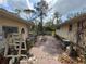 Backyard with brick flooring between two houses and an outdoor space at 3112 Desoto Rd, Sarasota, FL 34234