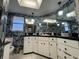 Unique bathroom boasts black countertops, unique wallpaper, and ample vanity storage at 3112 Desoto Rd, Sarasota, FL 34234