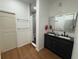 Modern bathroom with a double vanity, sleek mirrors, and a glass-enclosed shower at 3112 Desoto Rd, Sarasota, FL 34234