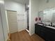 Modern bathroom with a double vanity, sleek mirrors, and a glass-enclosed shower at 3112 Desoto Rd, Sarasota, FL 34234
