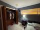 Simple bedroom with a closet, neutral colors, and tile flooring at 3112 Desoto Rd, Sarasota, FL 34234