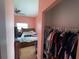 Bedroom view featuring attached closet with rod and shelf for ample storage at 3112 Desoto Rd, Sarasota, FL 34234