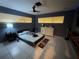 Bedroom featuring tile floors, modern color scheme, and a dresser for storage at 3112 Desoto Rd, Sarasota, FL 34234