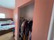Bedroom view featuring attached closet with rod and shelf for ample storage at 3112 Desoto Rd, Sarasota, FL 34234