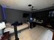 Bedroom with bed, TV, ceiling fan, desk and tile flooring at 3112 Desoto Rd, Sarasota, FL 34234
