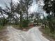 The property features a long gravel driveway that forks near the house at 3112 Desoto Rd, Sarasota, FL 34234
