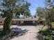 A charming single story home with a large driveway and attached two car garage at 3112 Desoto Rd, Sarasota, FL 34234
