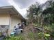 Exterior view showing the side of the home with yard, storage and natural surrounding landscape at 3112 Desoto Rd, Sarasota, FL 34234