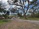 Spacious property featuring a house, trees, and driveway perfect for someone looking for a fixer upper at 3112 Desoto Rd, Sarasota, FL 34234