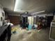 Garage featuring storage and household items, including a table tennis table at 3112 Desoto Rd, Sarasota, FL 34234