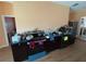 A simple kitchen includes modern appliances, dark wooden cabinets, and laminated wood floors at 3112 Desoto Rd, Sarasota, FL 34234