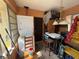 Bright laundry room with stacked washer and dryer, chair, and storage cabinets at 3112 Desoto Rd, Sarasota, FL 34234
