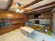 Cozy living room with stone fireplace, wooden beams, and built-in storage, perfect for Gathering gatherings at 3112 Desoto Rd, Sarasota, FL 34234