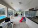 Relaxing screened patio includes dining area and views of the pool and backyard at 3112 Desoto Rd, Sarasota, FL 34234