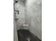 Shower featuring designer grey tile surround and decorative black and white tile on the shower floor at 3112 Desoto Rd, Sarasota, FL 34234
