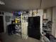 Storage room with shelves, refrigerator, tools, and clutter at 3112 Desoto Rd, Sarasota, FL 34234