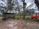 A shed is on the property and sits amongst trees and foliage at 3112 Desoto Rd, Sarasota, FL 34234