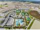 An aerial shot highlighting community amenities including pools and tennis courts at 31837 Cannon Rush Dr, San Antonio, FL 33576