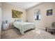 Inviting bedroom offers cozy carpet, large window with blinds, and stylish tropical-themed decor at 31837 Cannon Rush Dr, San Antonio, FL 33576