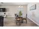 Well lit dining area features a glass table, seating for four, and offers a cozy space for meals at 31837 Cannon Rush Dr, San Antonio, FL 33576