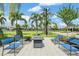 Outdoor seating area with a firepit, perfect for socializing in a park-like setting at 31837 Cannon Rush Dr, San Antonio, FL 33576