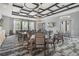 Inviting card and game area with tables, chairs, and decorative lighting fixtures at 31837 Cannon Rush Dr, San Antonio, FL 33576