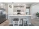 Modern kitchen with stainless steel appliances, light gray cabinetry, and a center island with seating at 31837 Cannon Rush Dr, San Antonio, FL 33576
