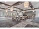 Spacious meeting area with round tables, chairs, and large windows offering natural light at 31837 Cannon Rush Dr, San Antonio, FL 33576