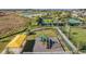 Aerial shot of a community playground and tennis courts, offering a recreational space at 31837 Cannon Rush Dr, San Antonio, FL 33576